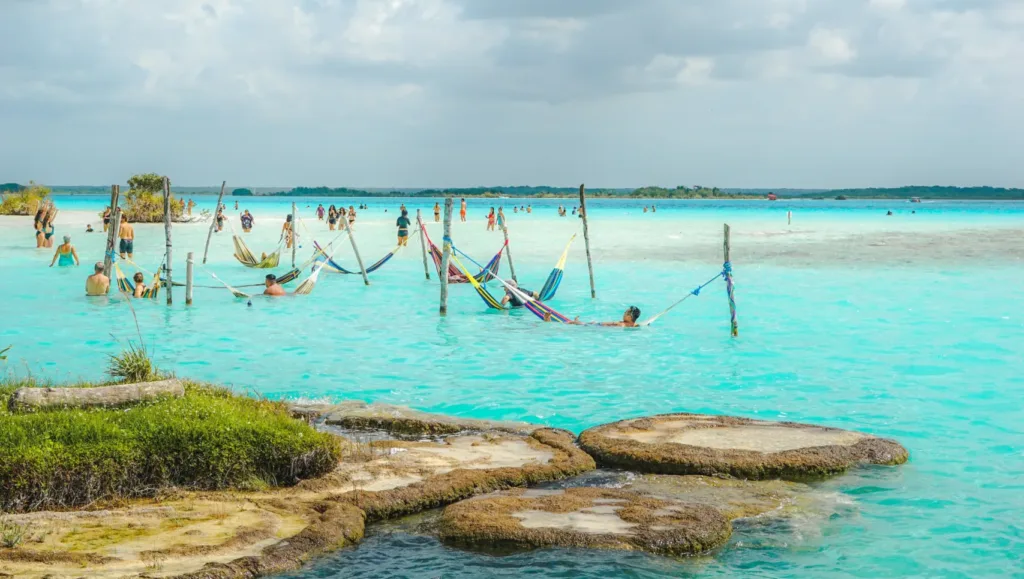 Hammocks in the water at Bacalar Lagoon near stromatolites.